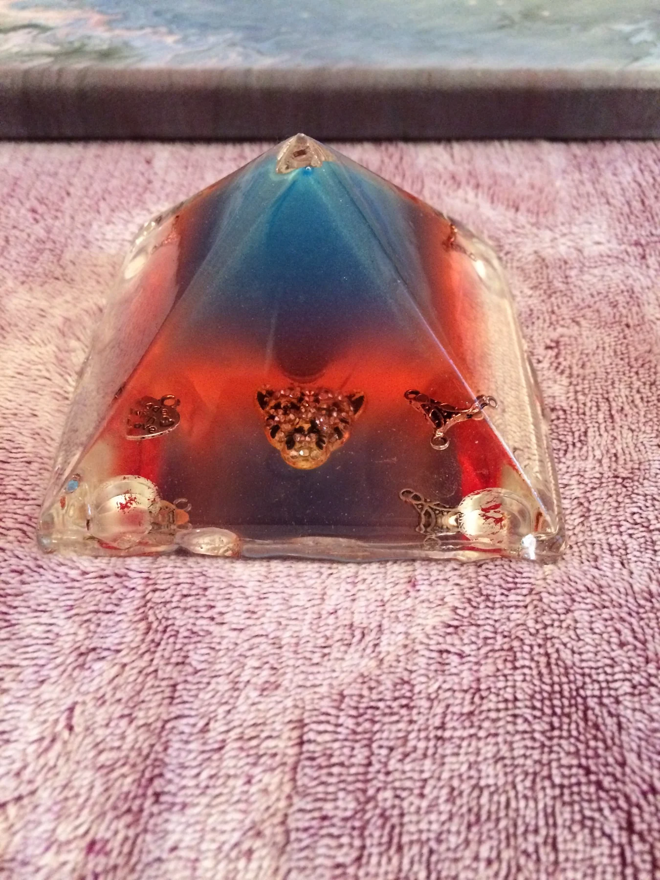 Red and blue resin pyramid with metallic details